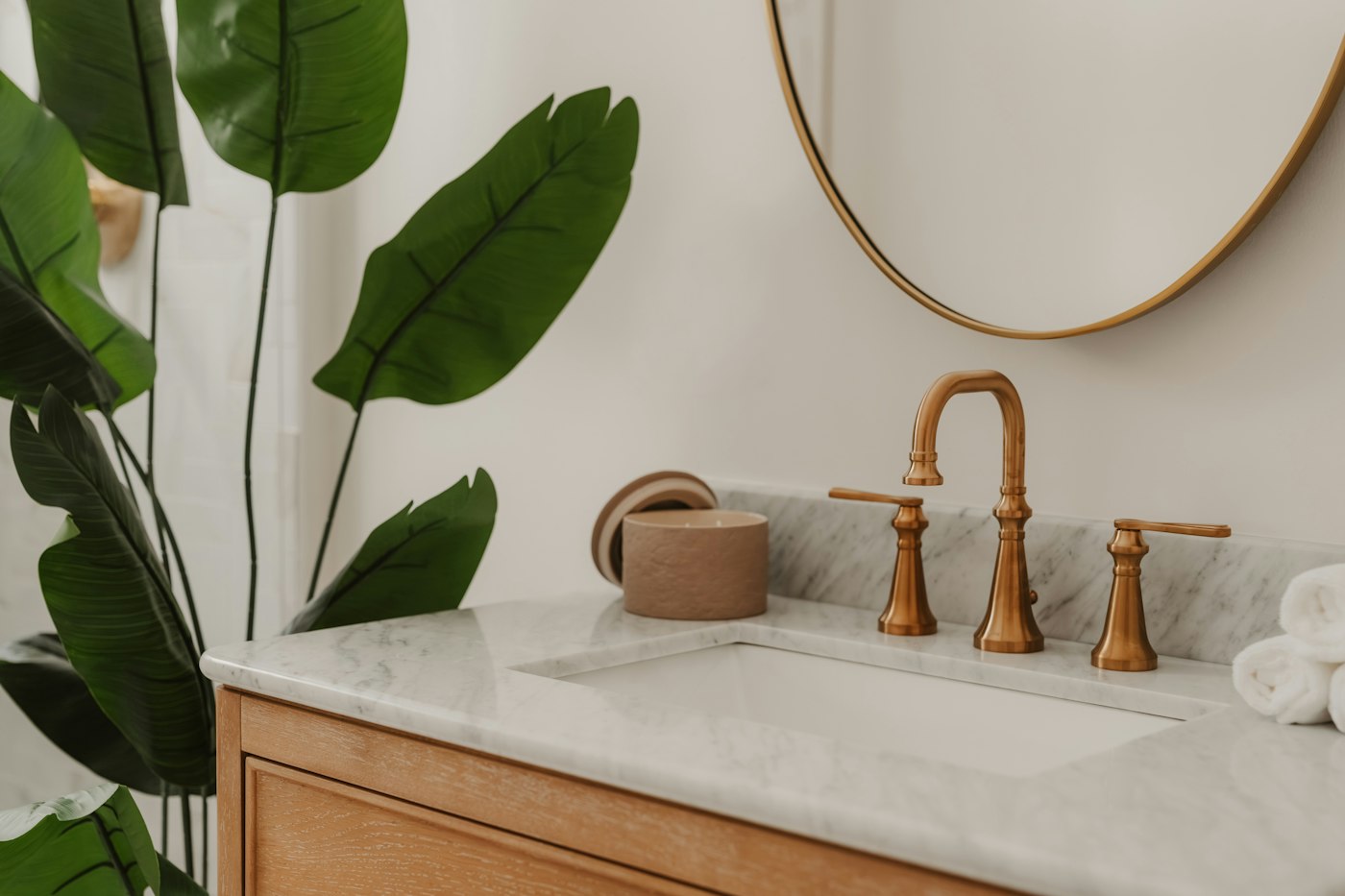 Modern bathroom sink and brass plumbing fixtures